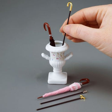 Umbrella stand with 3 sticks + 2 umbrellas, reuters