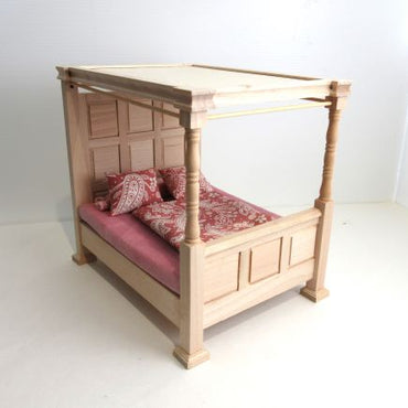 4 poster canopy bed unmade with bedding