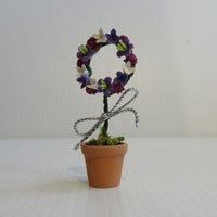Blomsterkrans i krukke