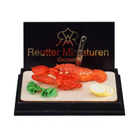 Lobster on wooden board, reutters