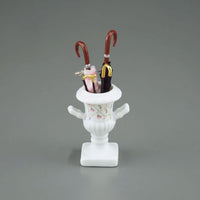 Umbrella stand with 3 sticks + 2 umbrellas, reuters