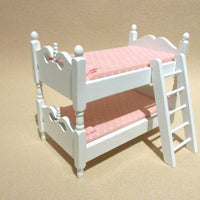 White lacquered bunk bed with pink mattresses