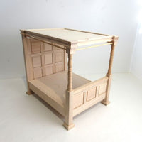 4 poster canopy bed unmade with bedding