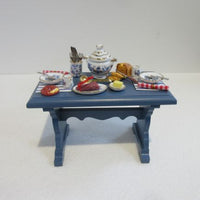 Blue kitchen table w/ place setting