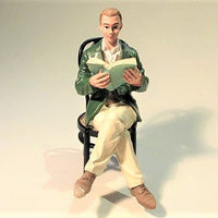 Man sitting with book, resin (chair not included)